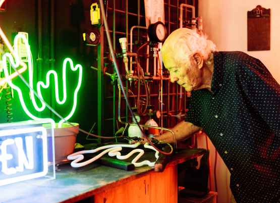 man-checking-neon-sign-in-workshop-with-gas-pump-s-2024-06-21-21-06-45-utc man-checking-neon-sign-in-workshop-with-gas-pump-s-2024-06-21-21-06-45-utc